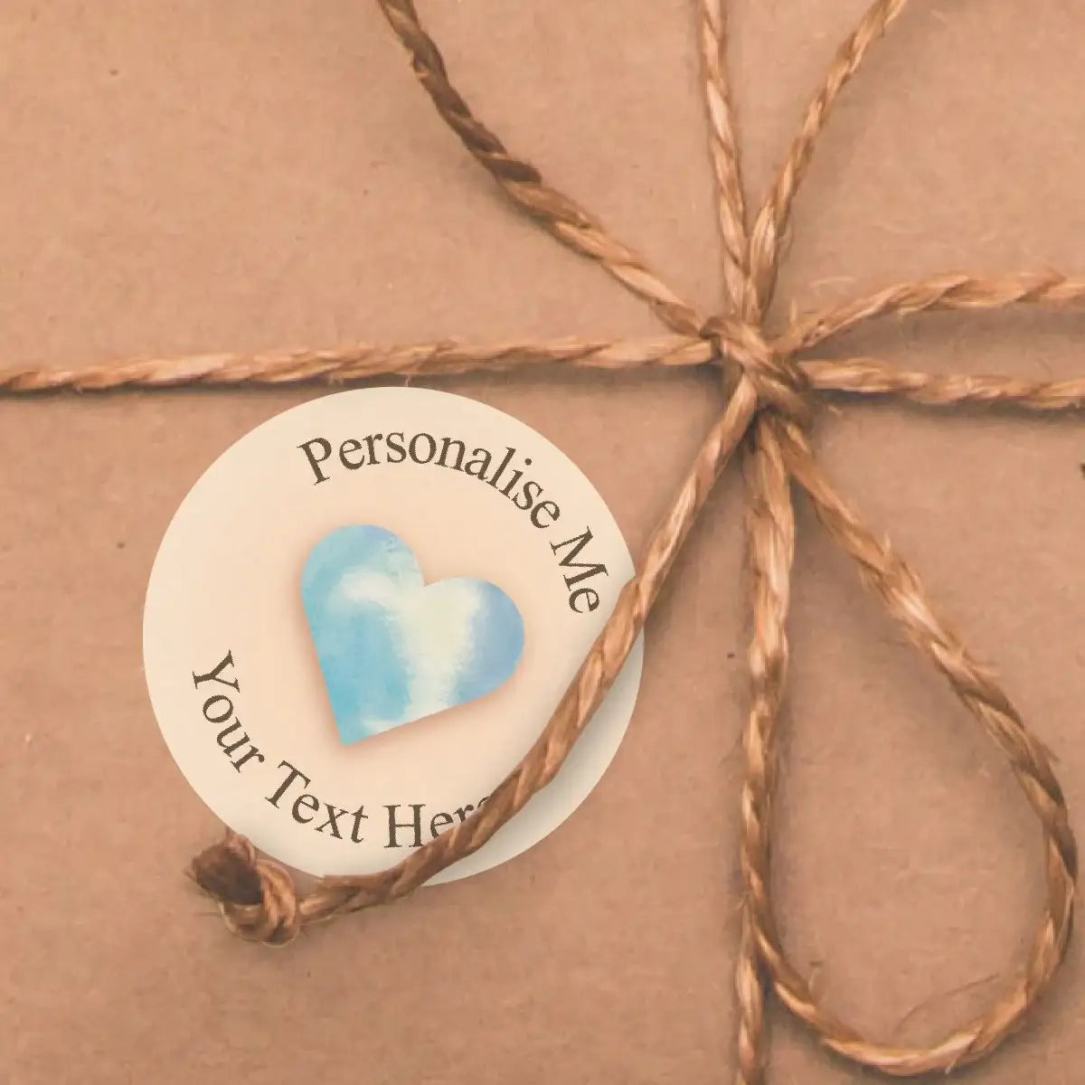 Personalised sticker with blue heart on brown wrapped gift with twine bow