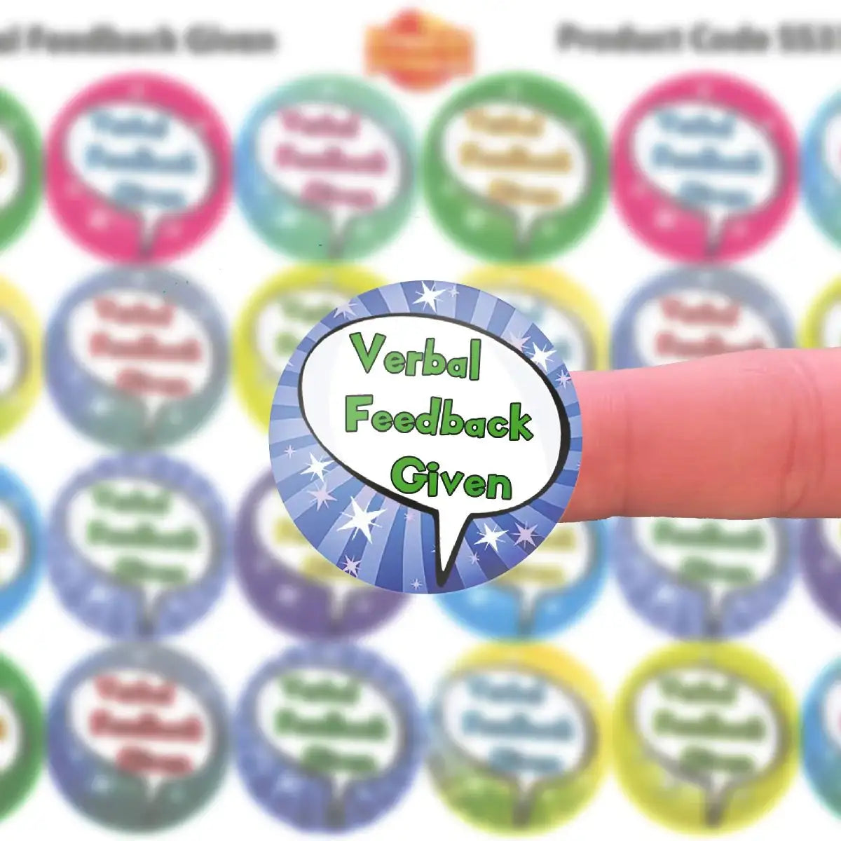 Verbal Feedback Given reward sticker held on finger, colorful background of similar stickers.