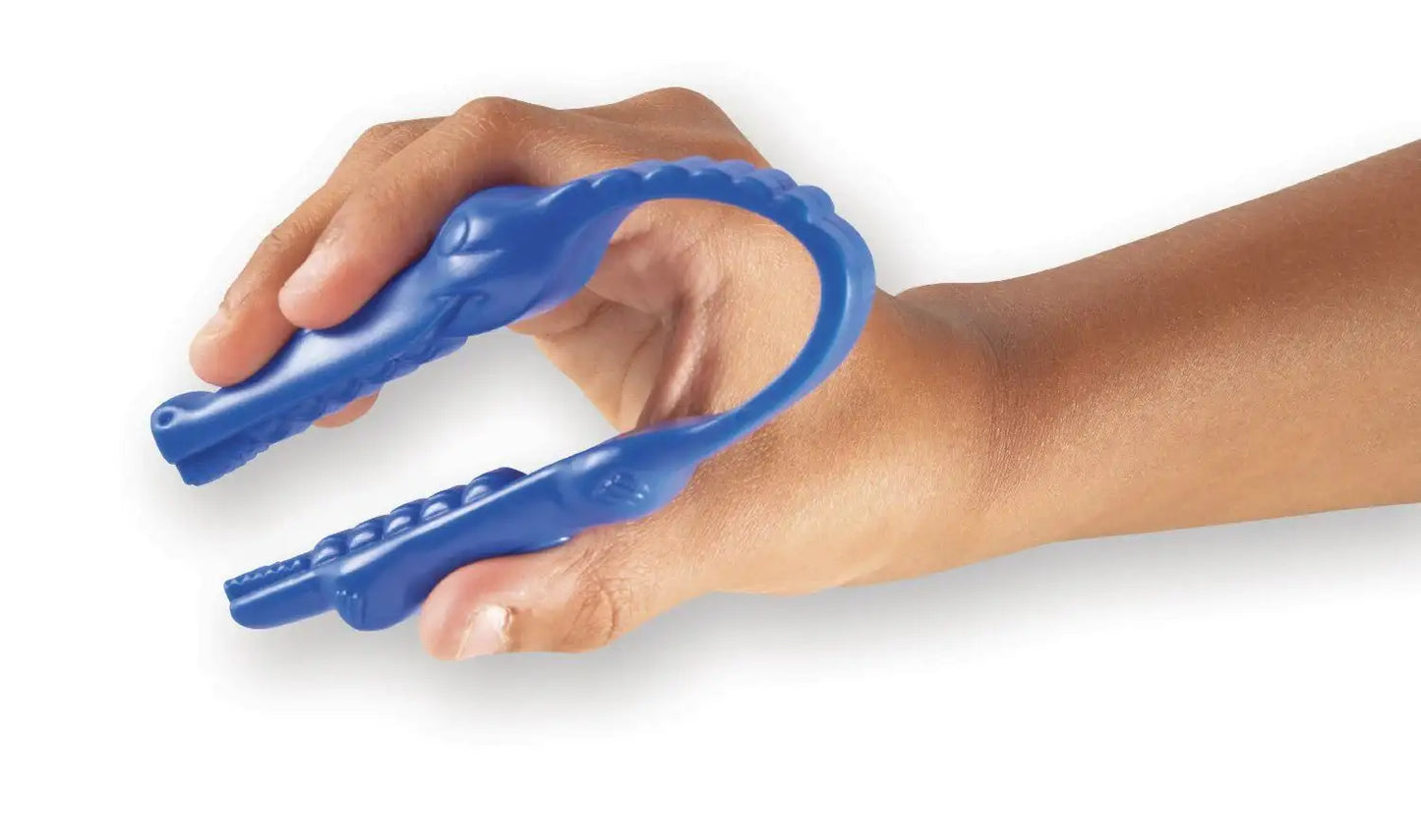 Child's hand using blue alligator-shaped fine motor skills tool