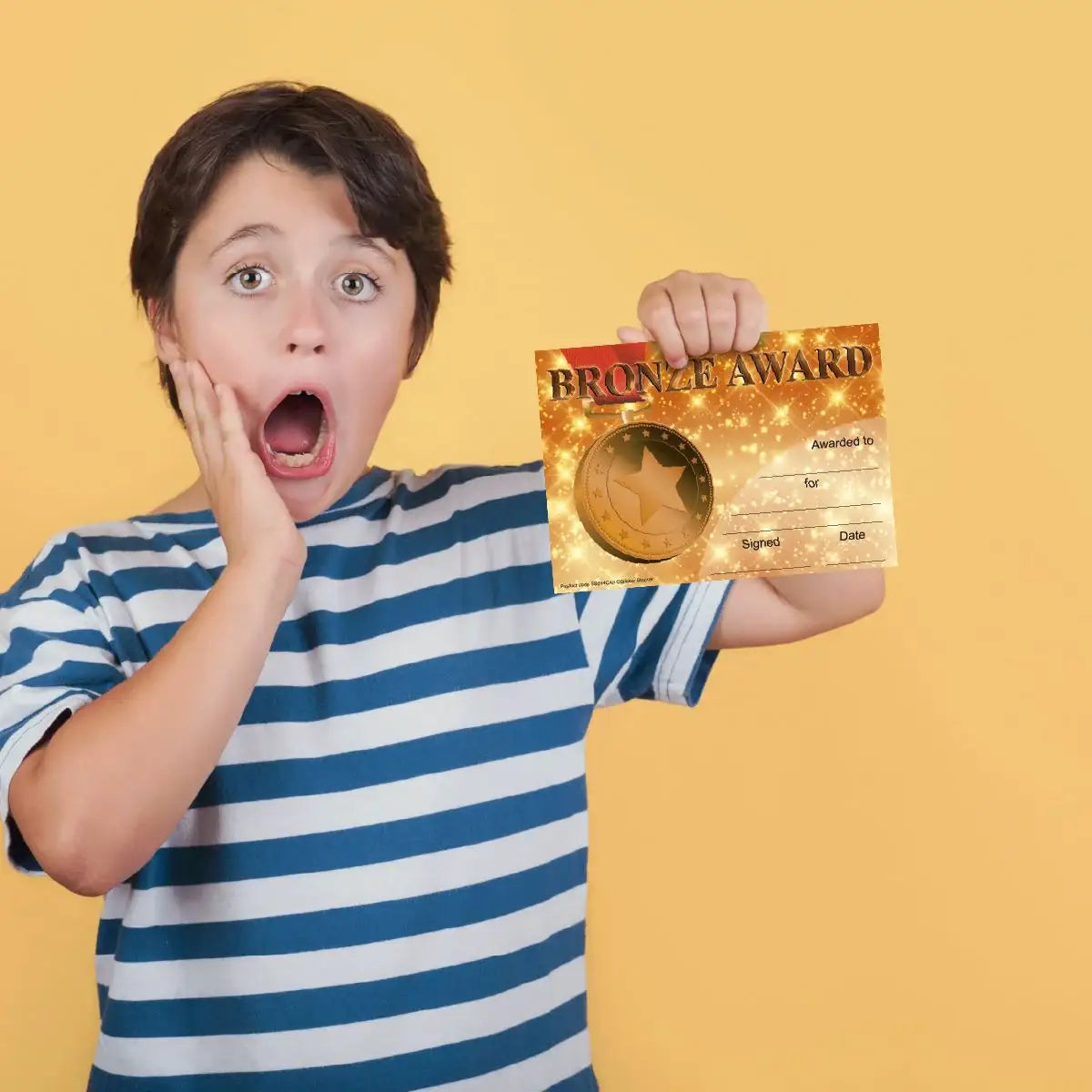 Surprised child holding a bronze award certificate, reward for students or classroom achievement