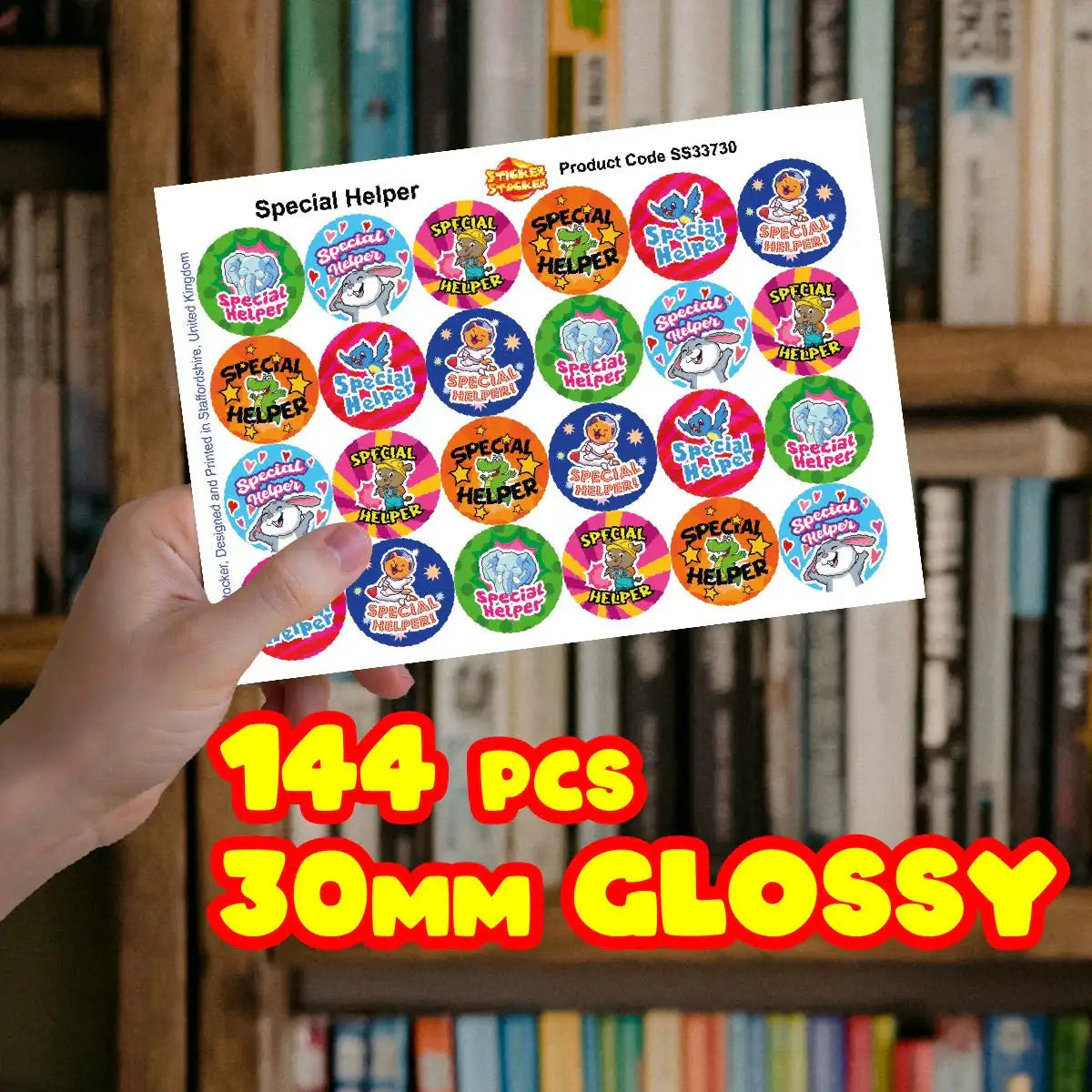 Hand holding sheet of colorful special helper reward stickers, 144 pieces, 30mm glossy