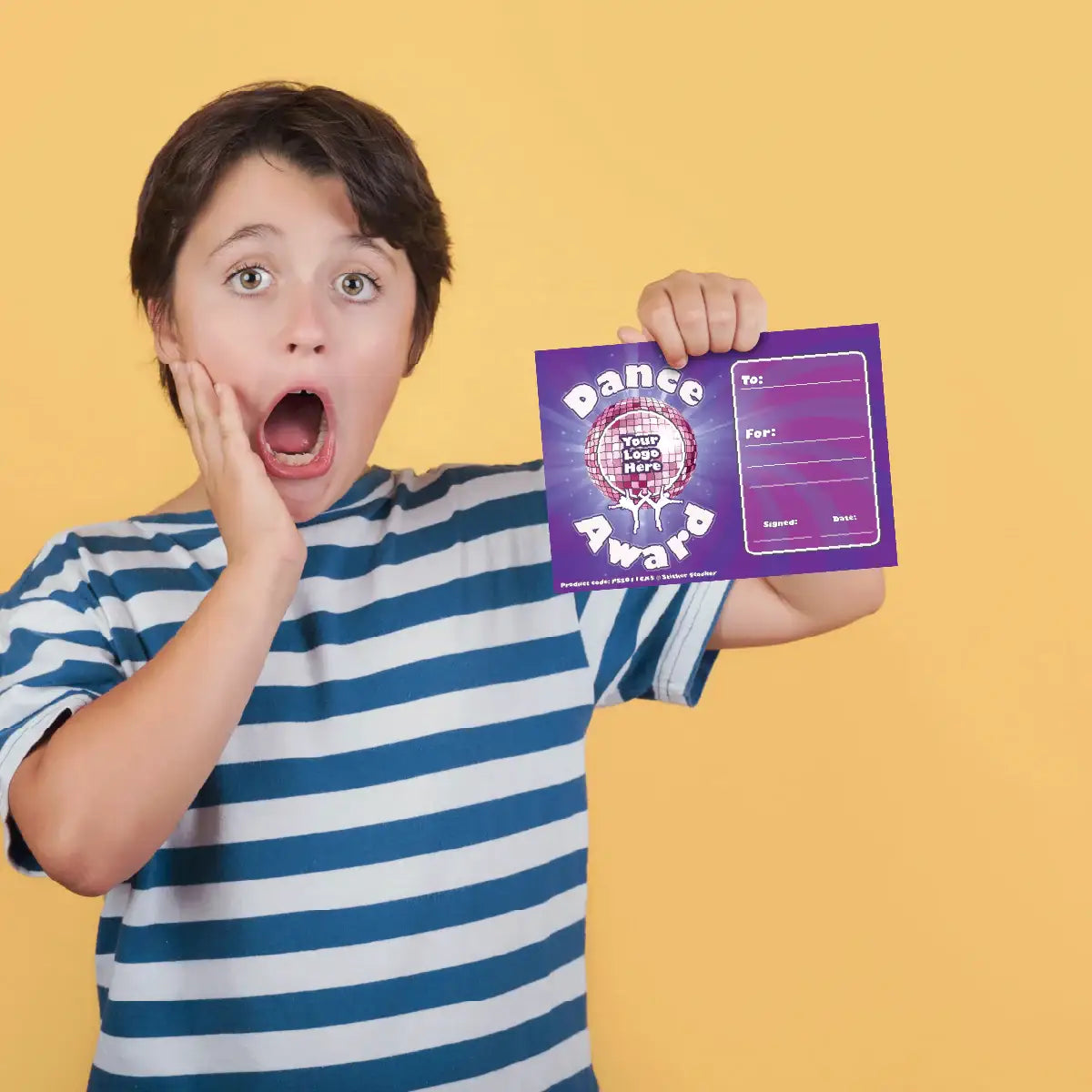 Surprised child in striped shirt holding purple dance award certificate on yellow background