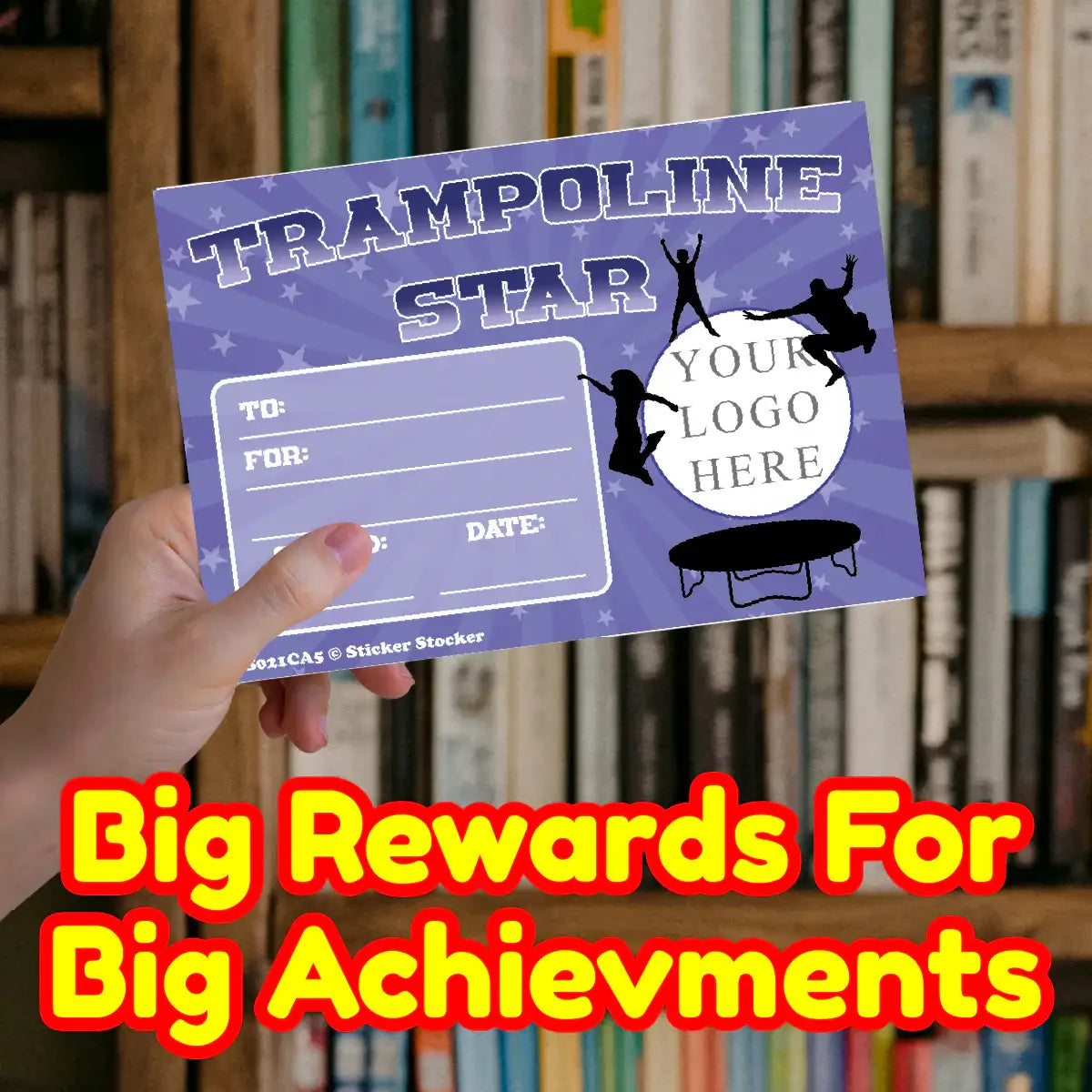 Hand holding a Trampoline Star reward card with blank fields, library background, motivational text