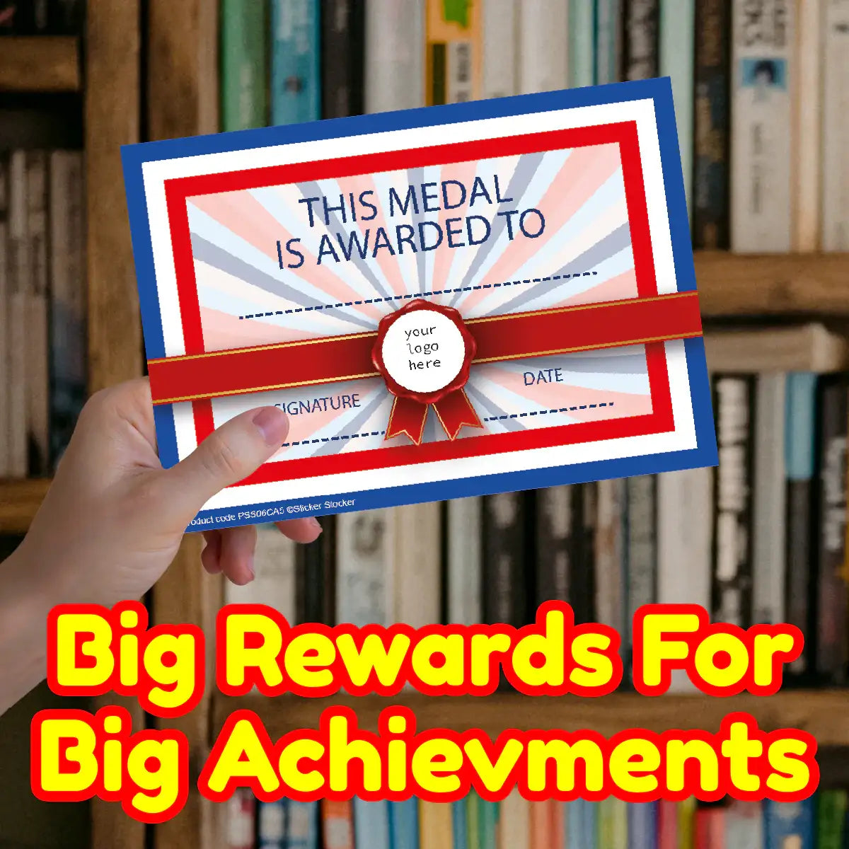 Person holding a colorful classroom award certificate with bold reward text, books in background