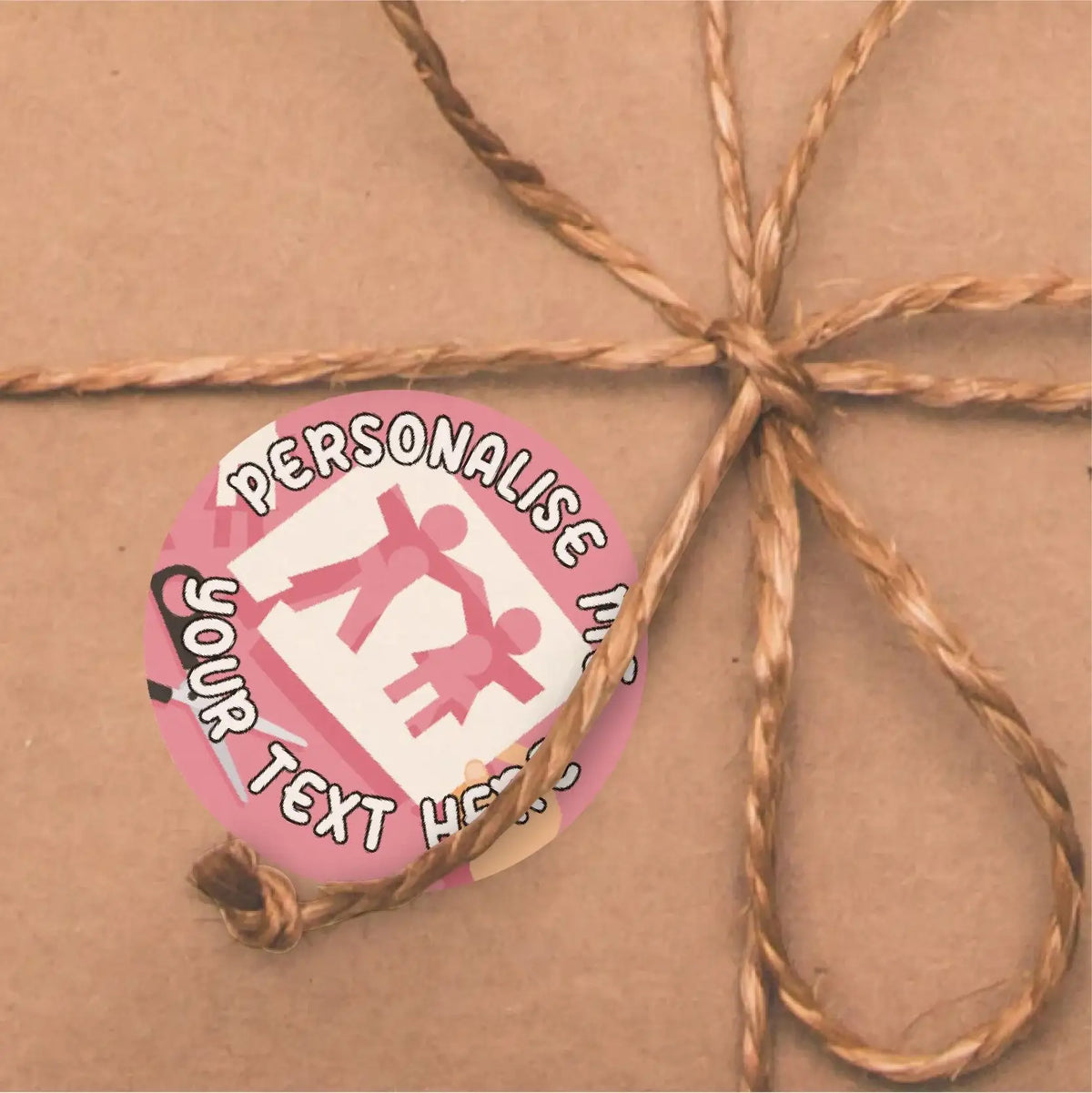 Customisable pink family reward sticker on brown gift wrap with twine bow
