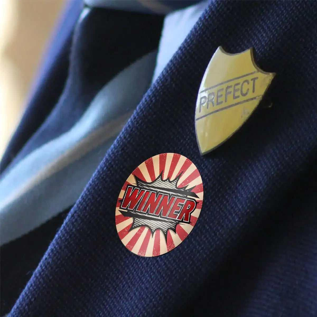 Winner reward sticker and prefect badge on school blazer lapel, classroom motivation