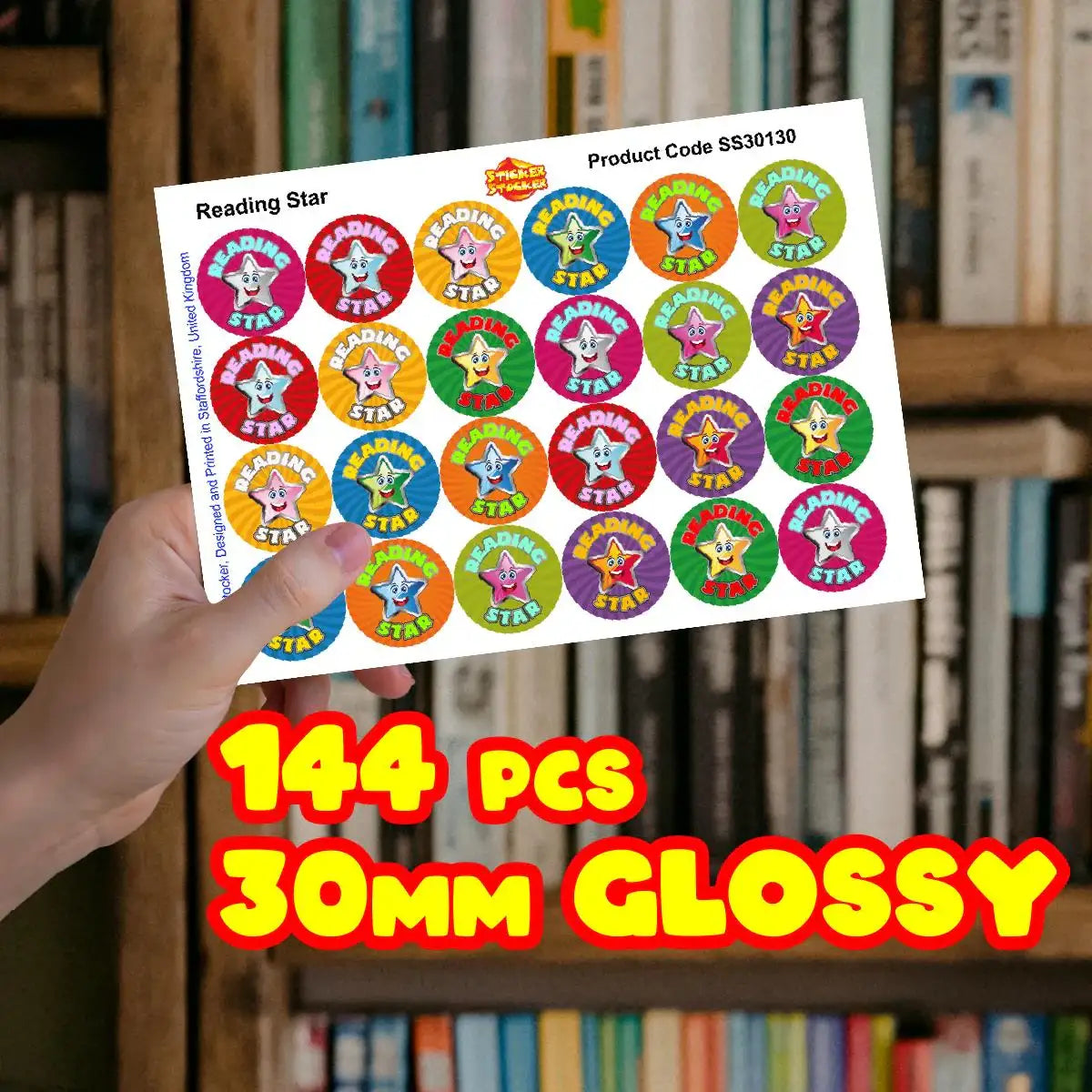 Hand holding sheet of Reading Star reward stickers for students, 144 pcs, 30mm glossy.