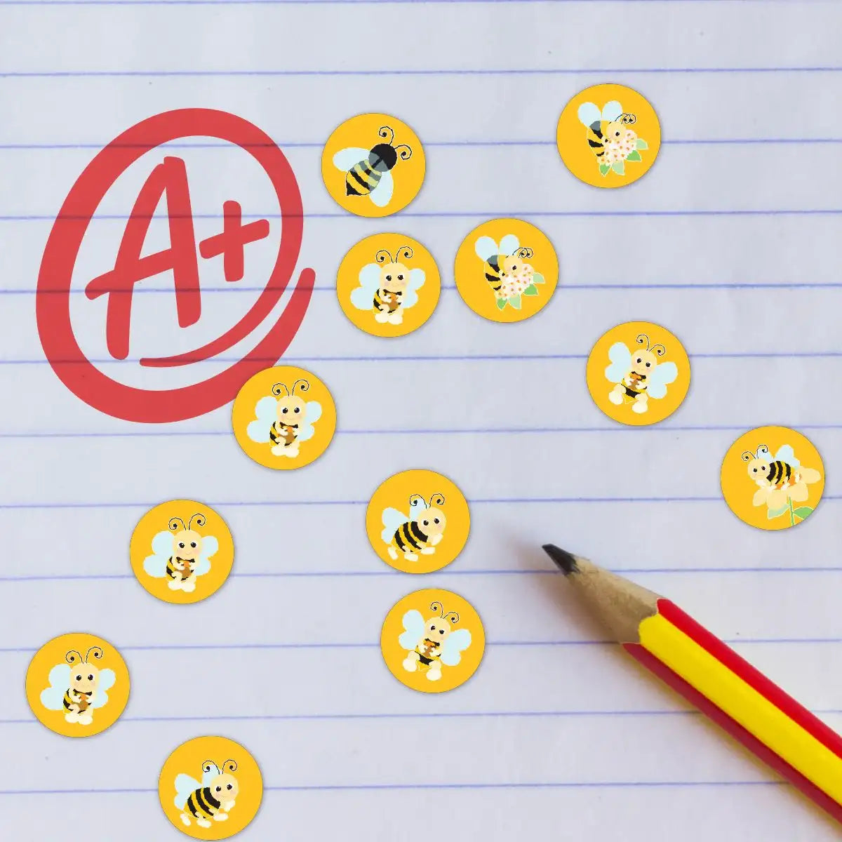 Bee reward stickers on lined paper with a red A+ and yellow pencil, classroom theme