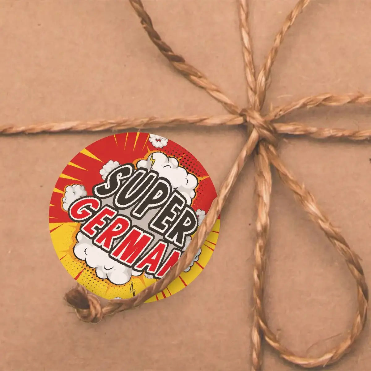 Super German reward sticker with comic design on brown gift wrap tied with twine