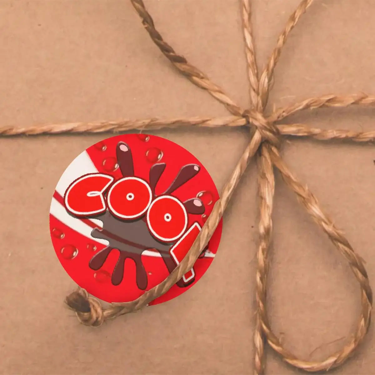 Red cool reward sticker with splatter design on brown gift box tied with twine
