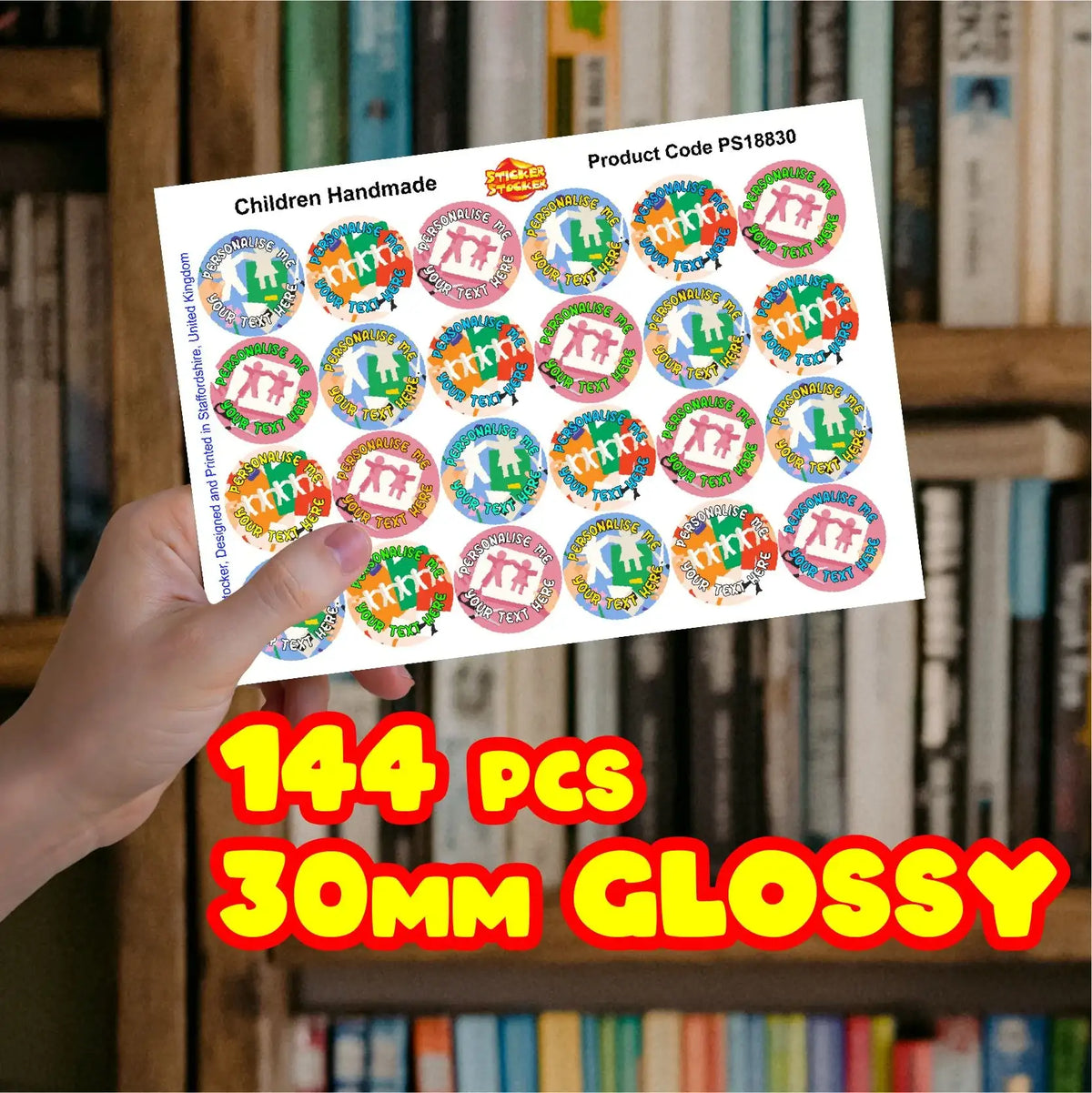 Hand holding sheet of 30mm glossy reward stickers for children, 144 pieces, colorful design