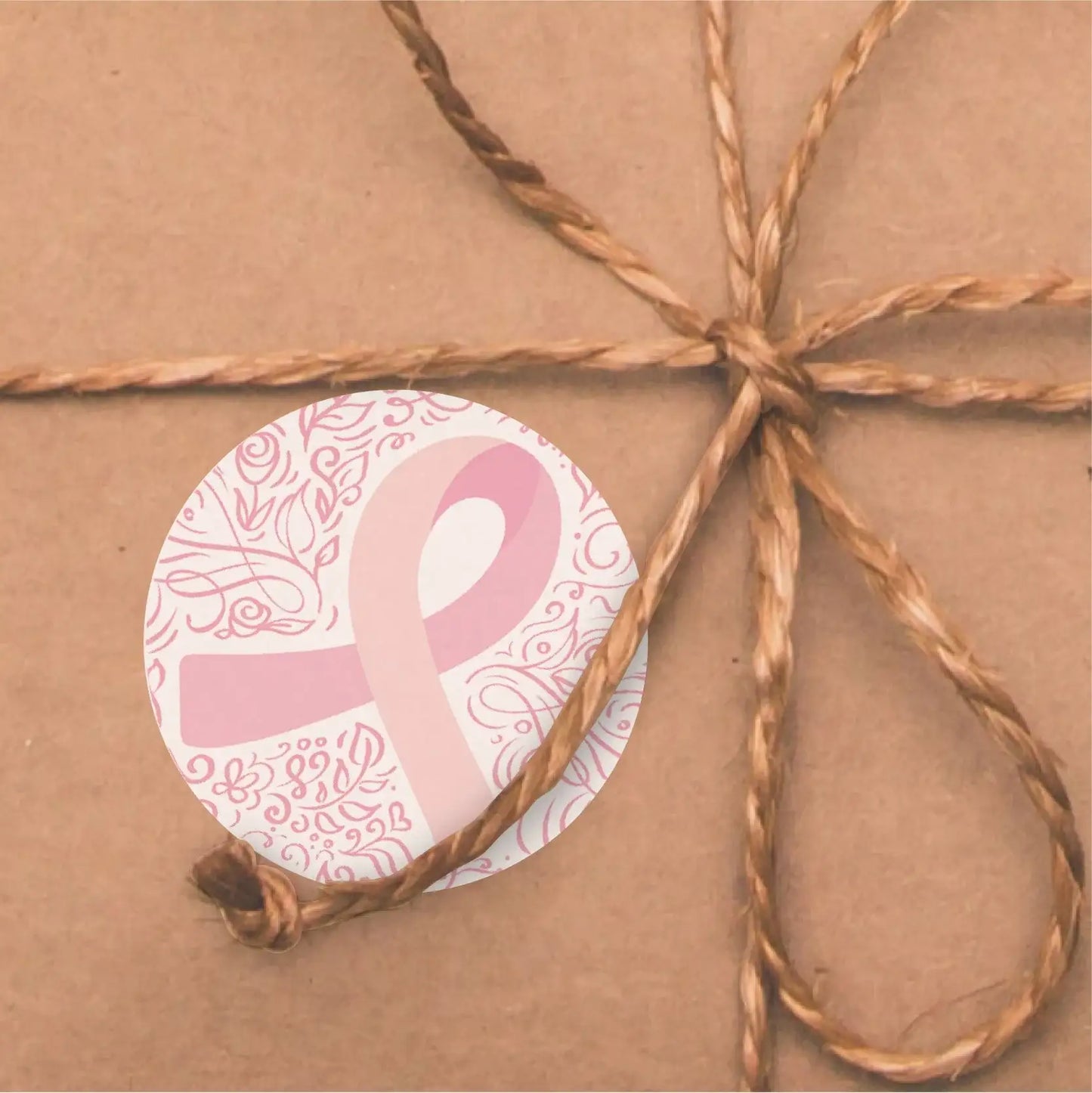 Pink ribbon sticker with floral design on wrapped gift, inspirational reward sticker