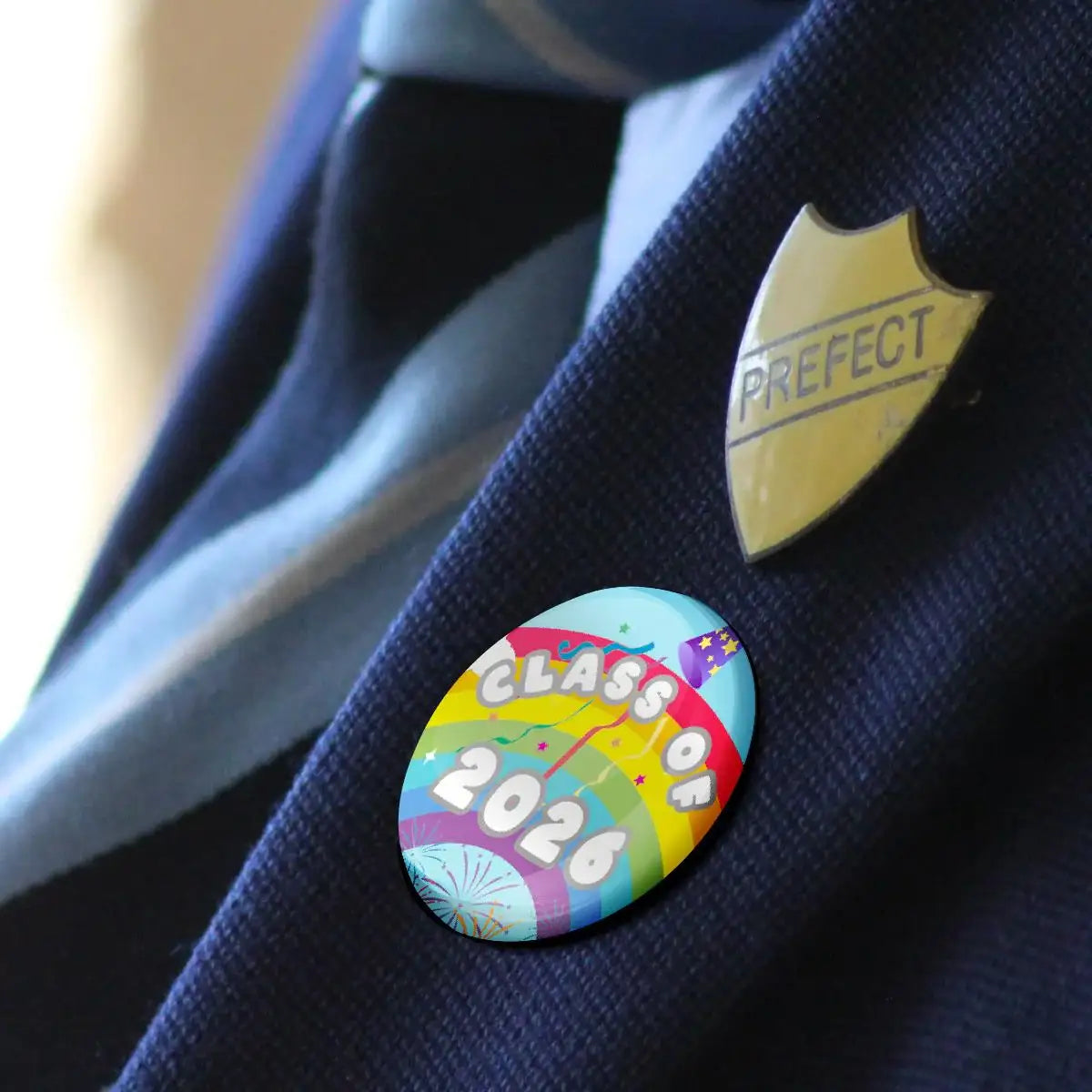 Colorful Class of 2026 badge and prefect pin on school uniform blazer