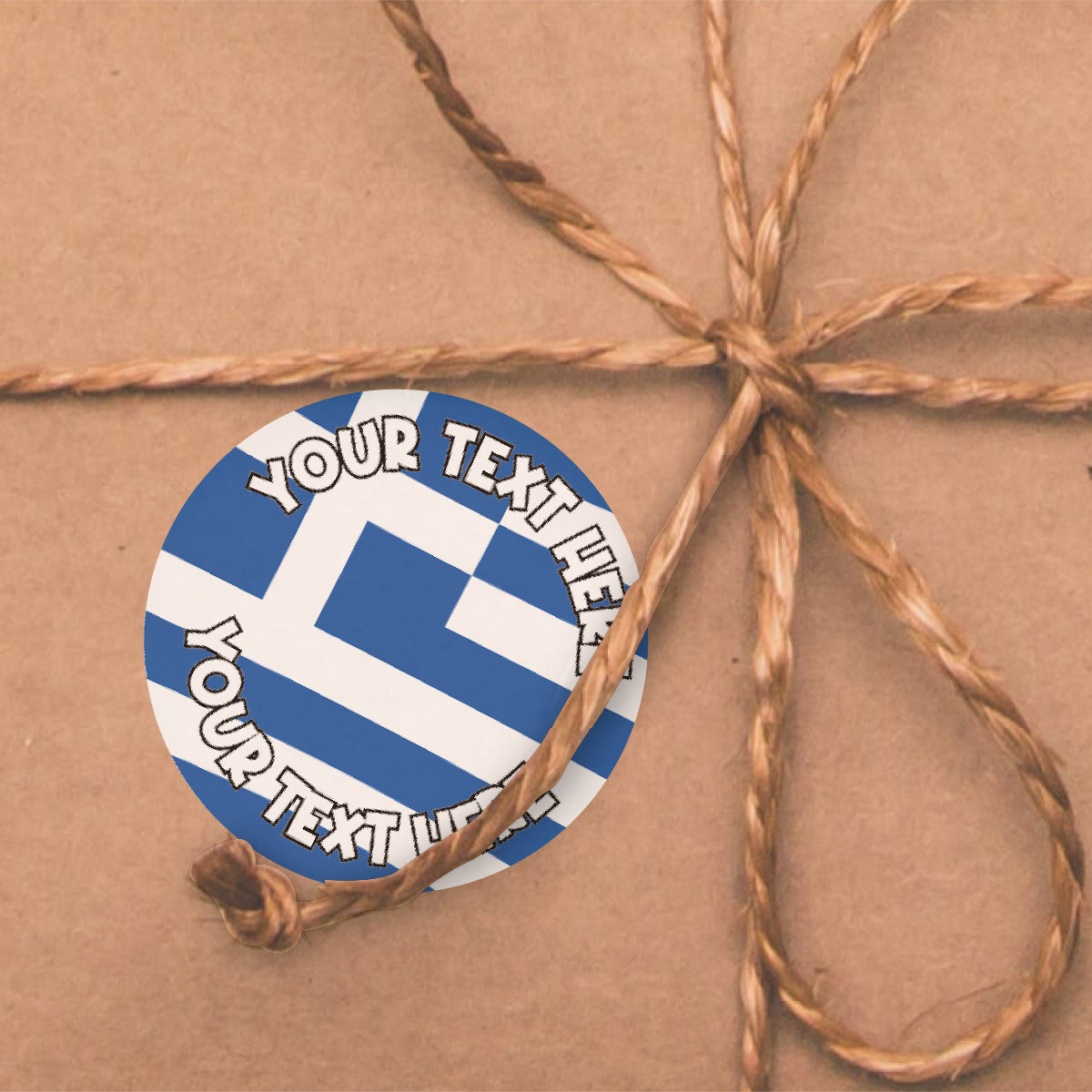 Custom Greek flag sticker on brown wrapped gift with twine bow, reward sticker design
