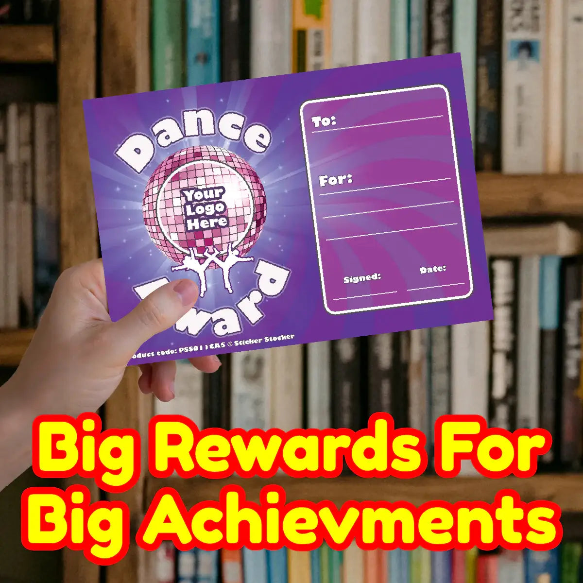 Hand holding purple dance award certificate for students, classroom reward card, books in background